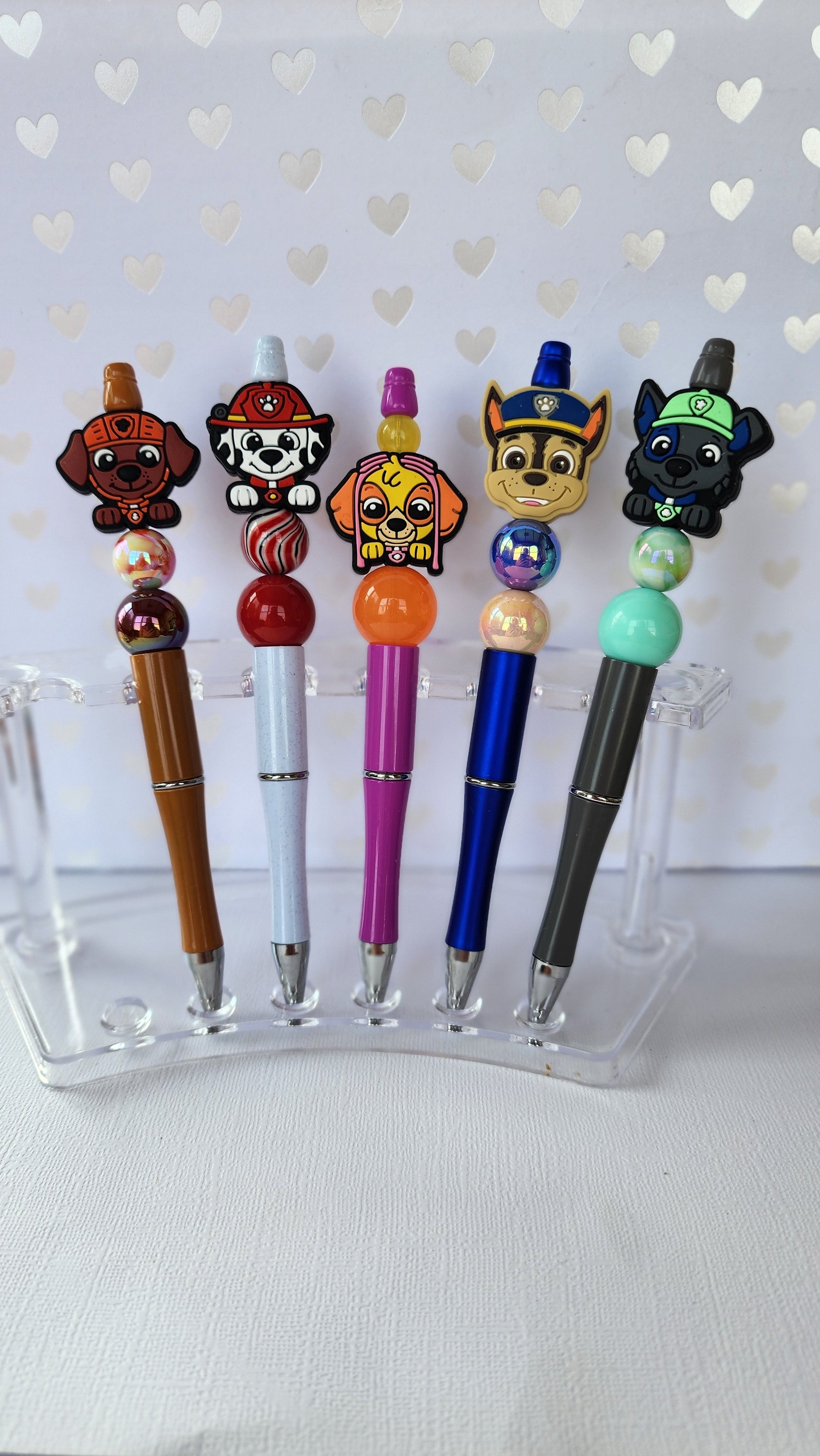 Five beaded writing pens with black ink and additional extra refills. The theme for this fun gift collection of journaling or writing accessories ante puppies or dogs.