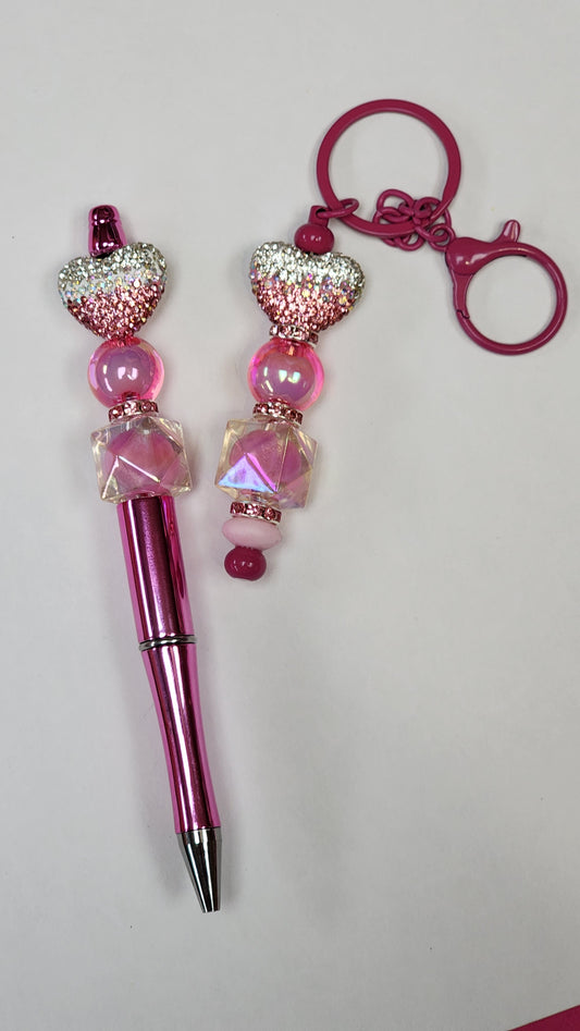 Stylish pink ombre beaded pen and matching keychain set, perfect for adding a pop of color to your accessories!